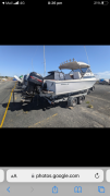 6.5 meter Bertram boat on trailer