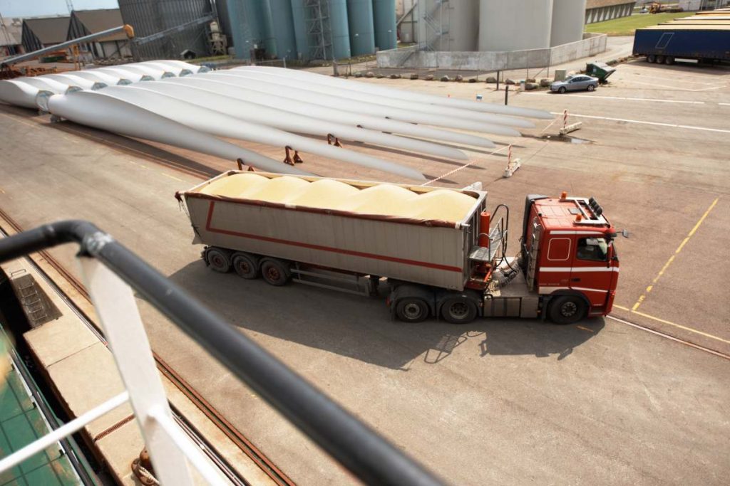 A photo of a truck in an industrial area.